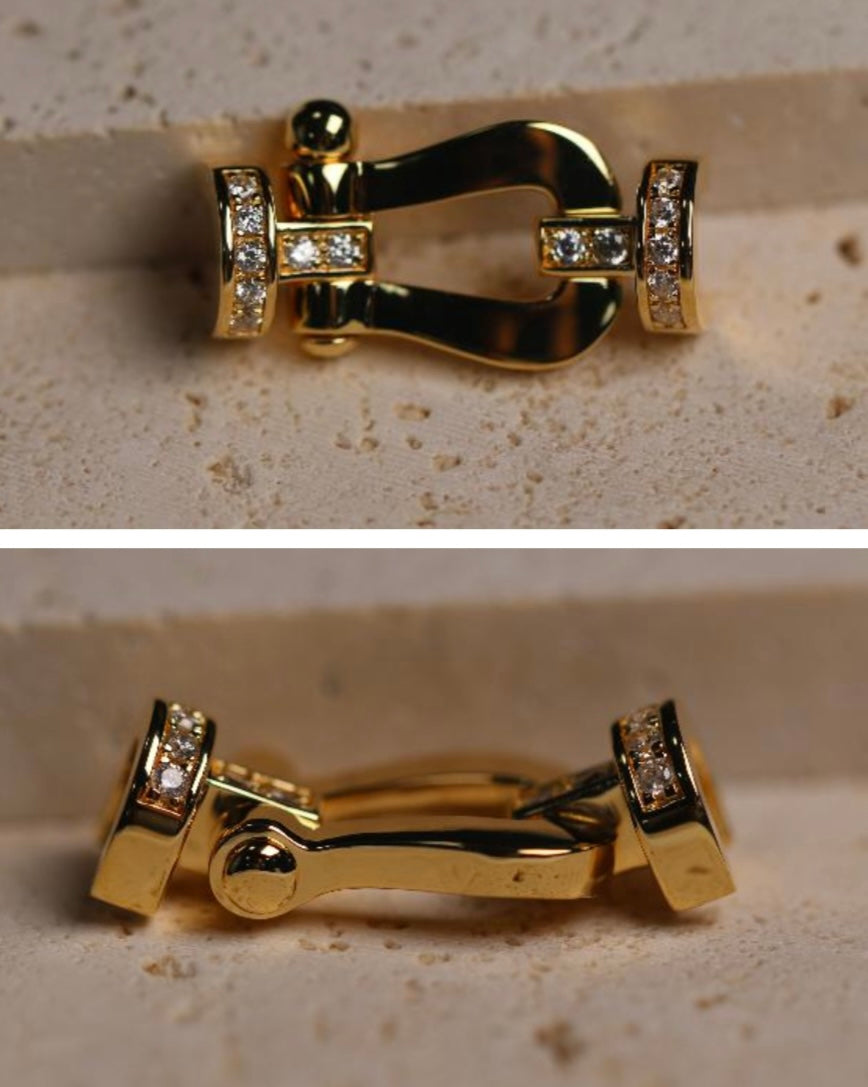 אבזם יוקרתי בגוון זהב משובץ זירקונים נוצצים