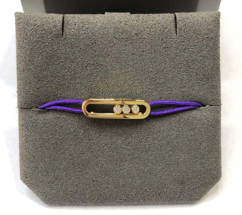 צמיד אהבה – חוט בגוון סגול עם אבזם בגוון זהב, 3 זירקונים נעים