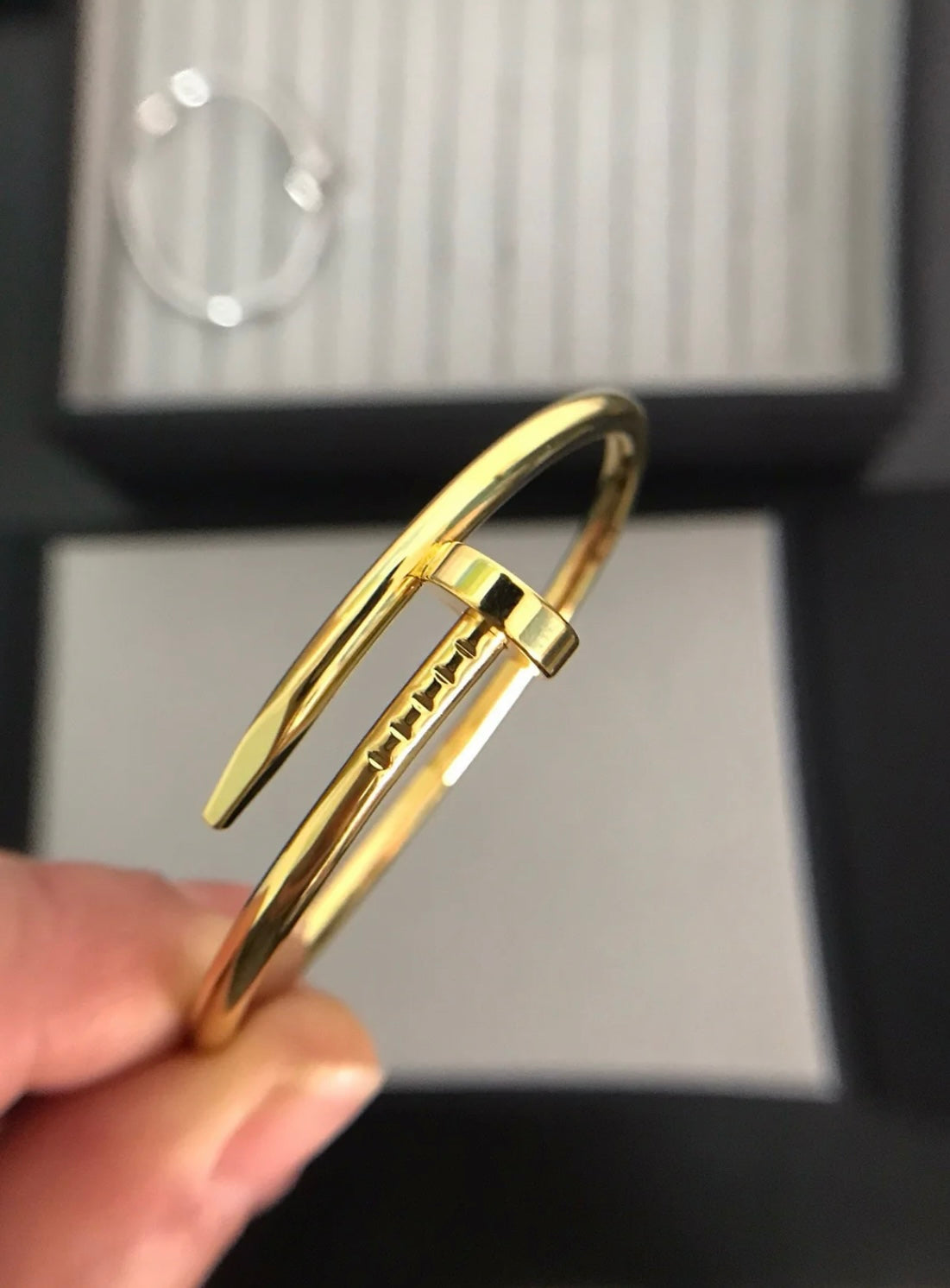 An elegant gold-tone nail bracelet with a touch of luxury