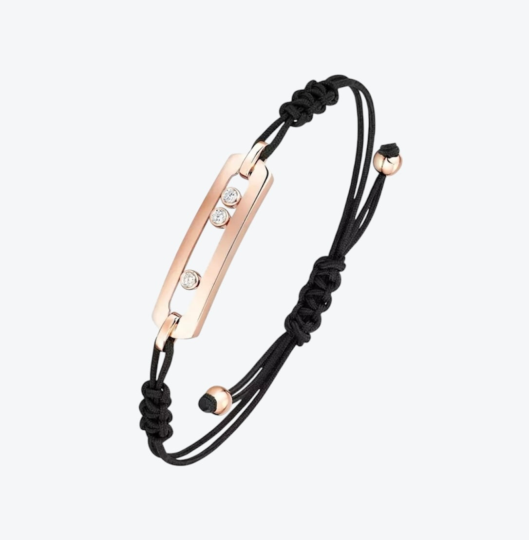 צמיד אהבה – חוט בגוון צהוב עם אבזם בגוון זהב, 3 זירקונים נעים