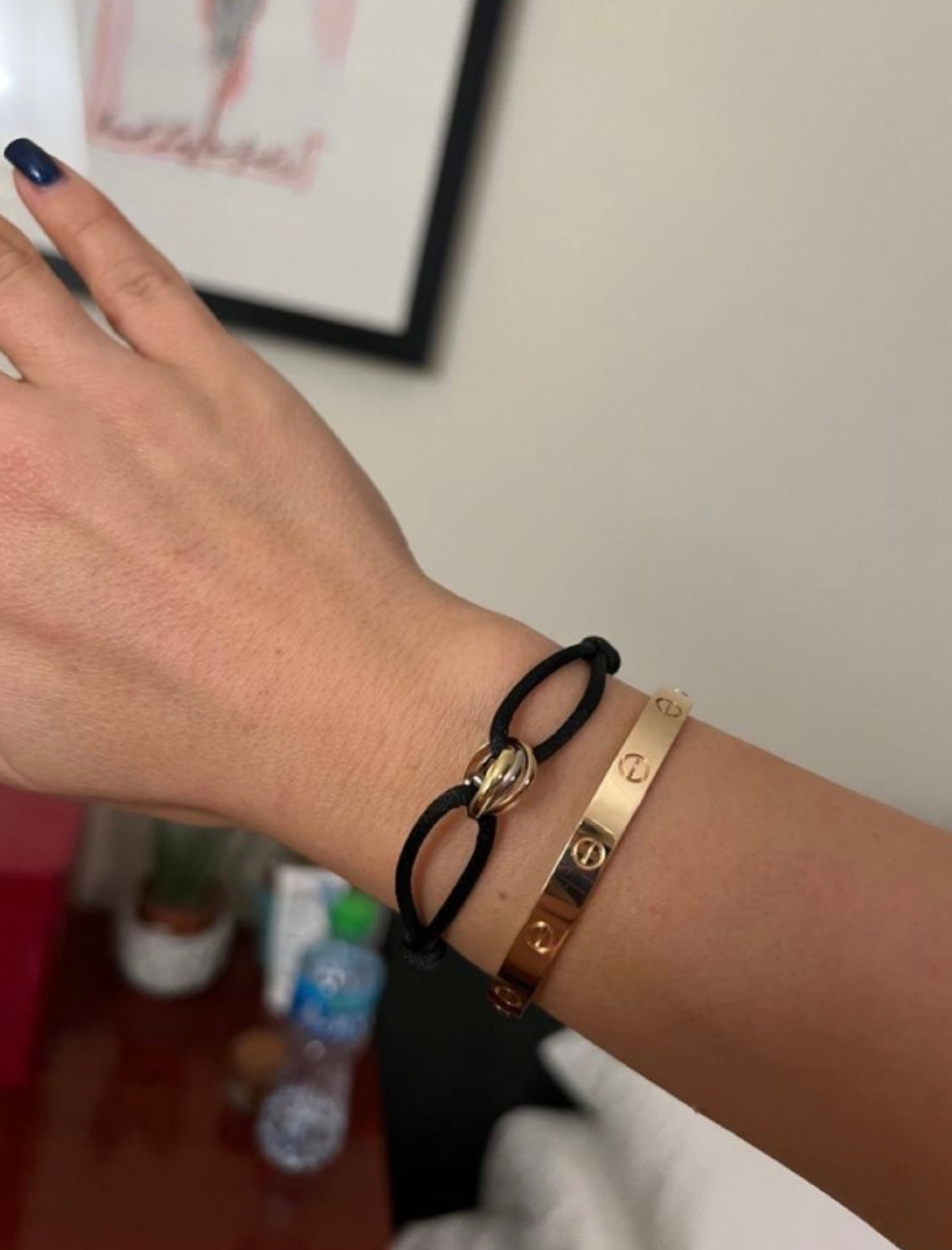 Elegant bracelet with a black cord and a triangular gold-toned ring — JEWELLUXE™