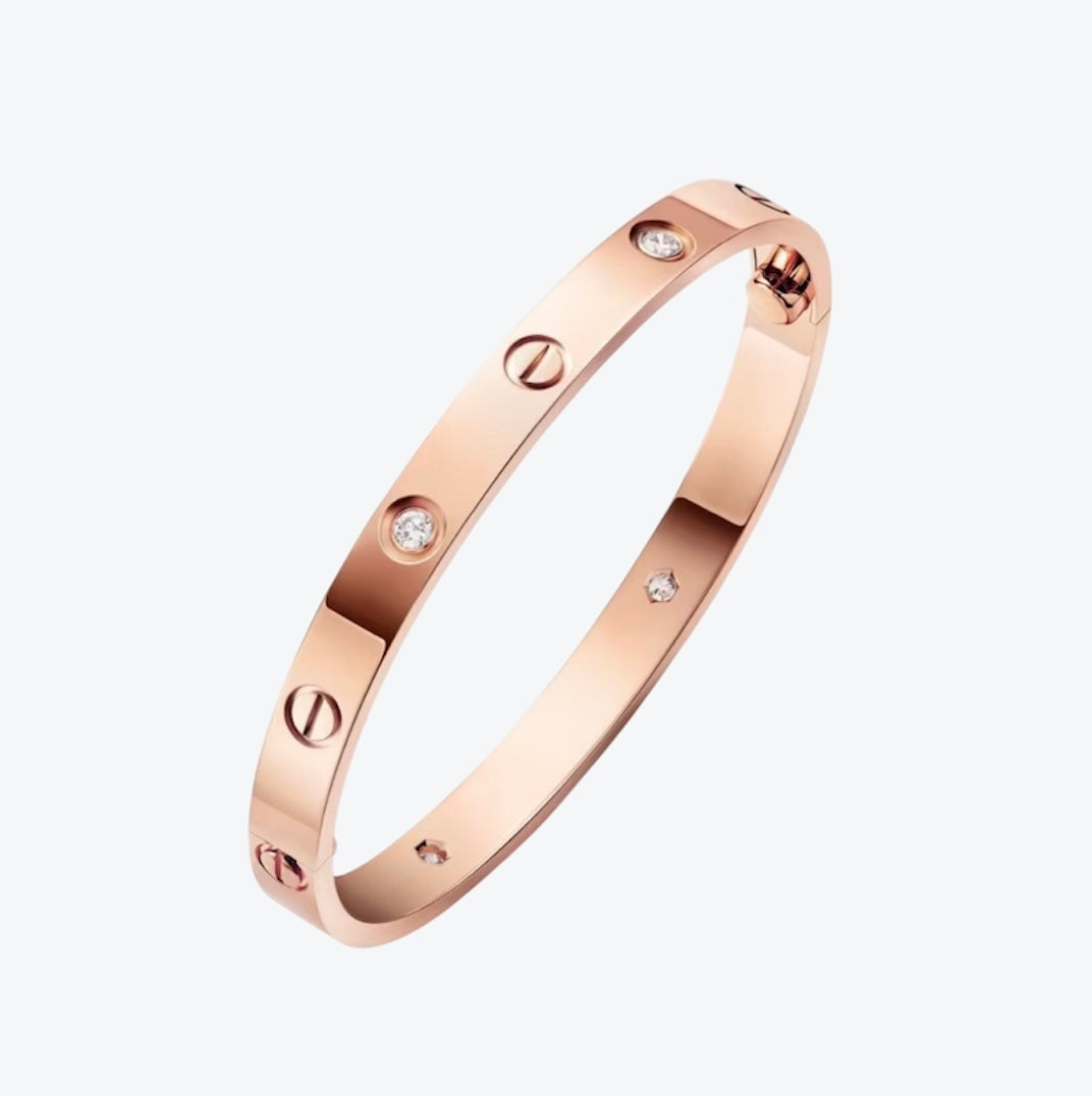 צמיד אלגנטי בגוון זהב ורוד משובץ 4 זירקונים נוצצים