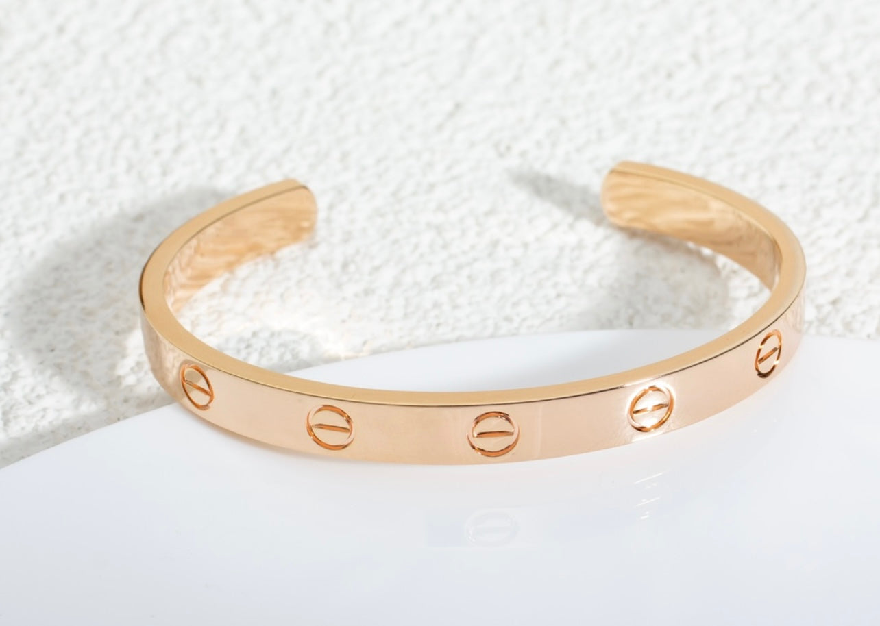 צמיד אלגנטי פתוח בגוון זהב ורוד מבריק