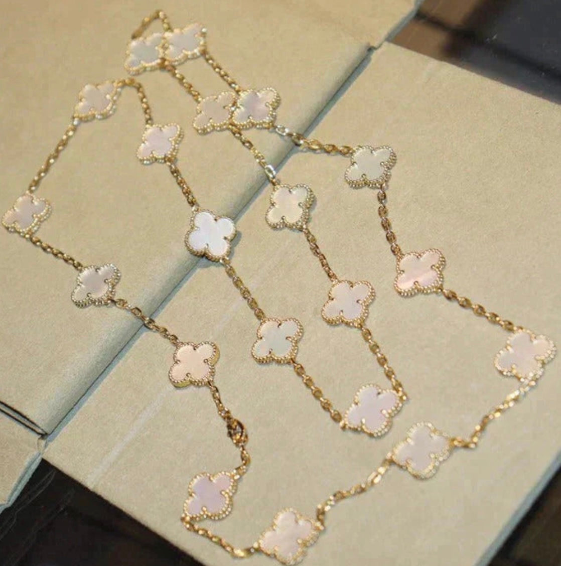 20-leaf clover necklace in gold with a white clover pendant