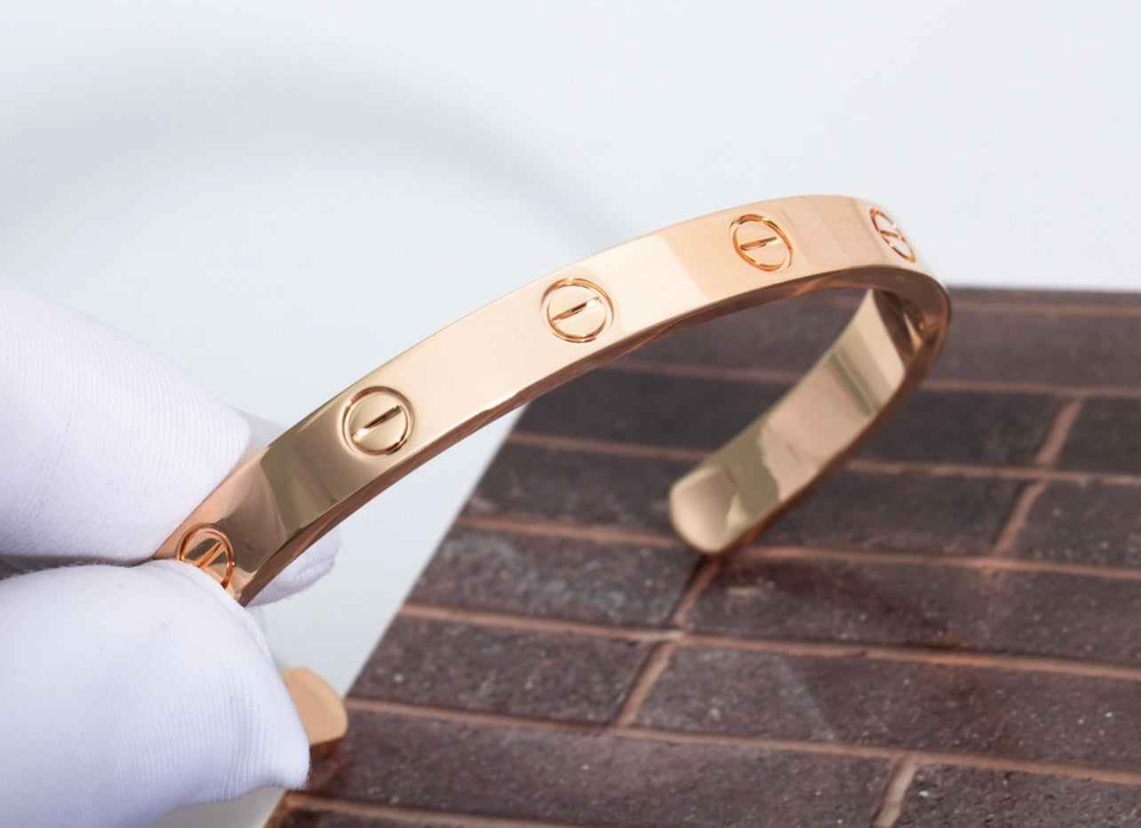 צמיד אלגנטי פתוח בגוון זהב ורוד מבריק