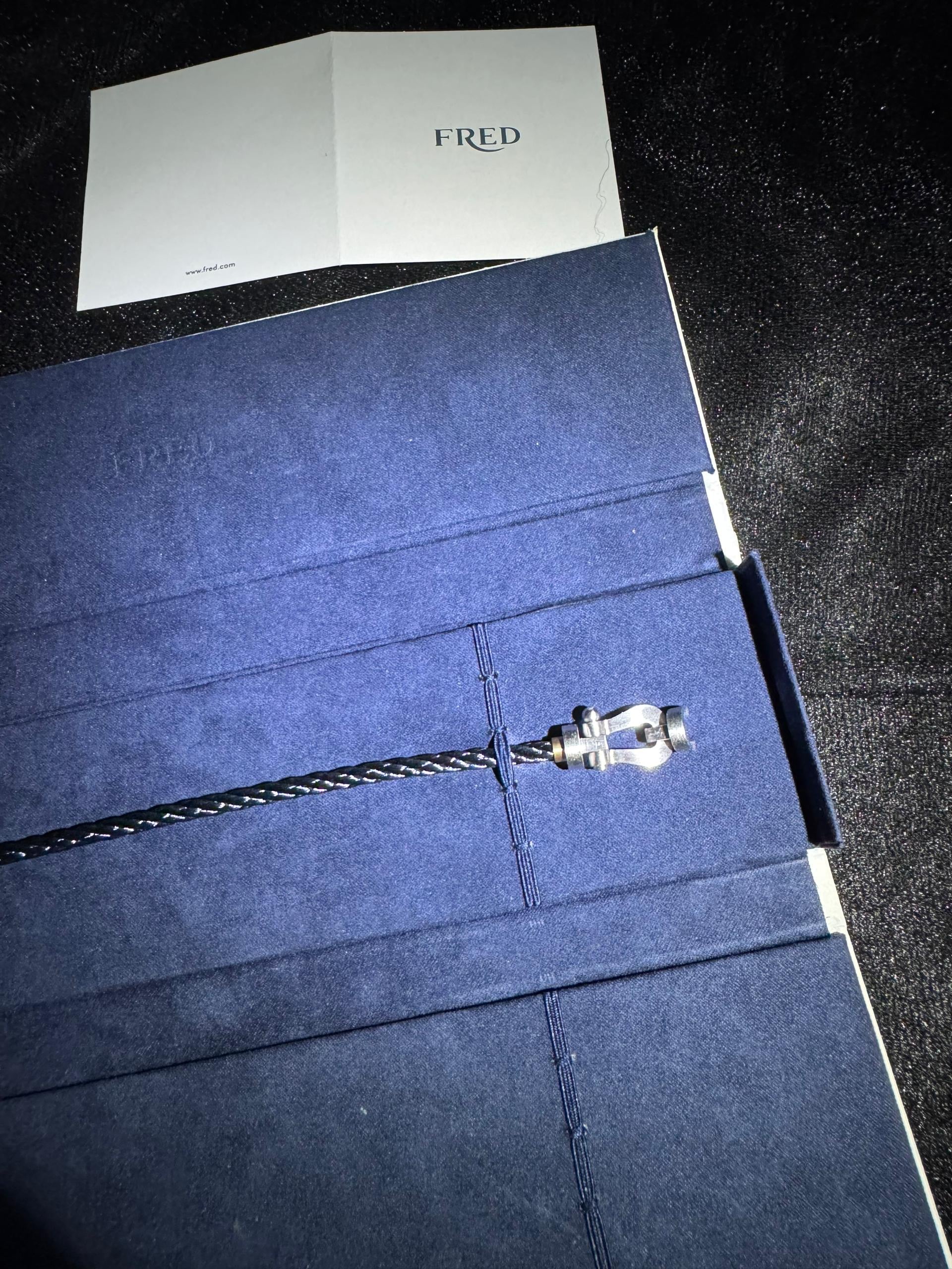 Luxury bracelet with a black rope strap and a brushed silver-tone clasp — JEWELLUXE™
