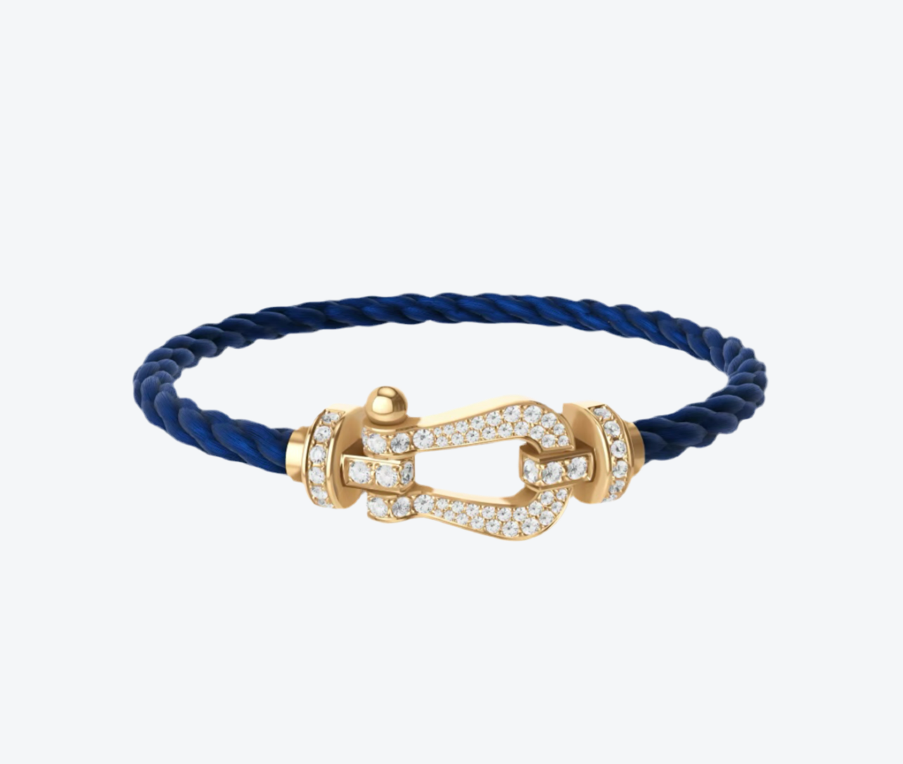 צמיד יוקרתי עם רצועת חבל כחולה ואבזם בגוון זהב משובץ זירקונים נוצצים