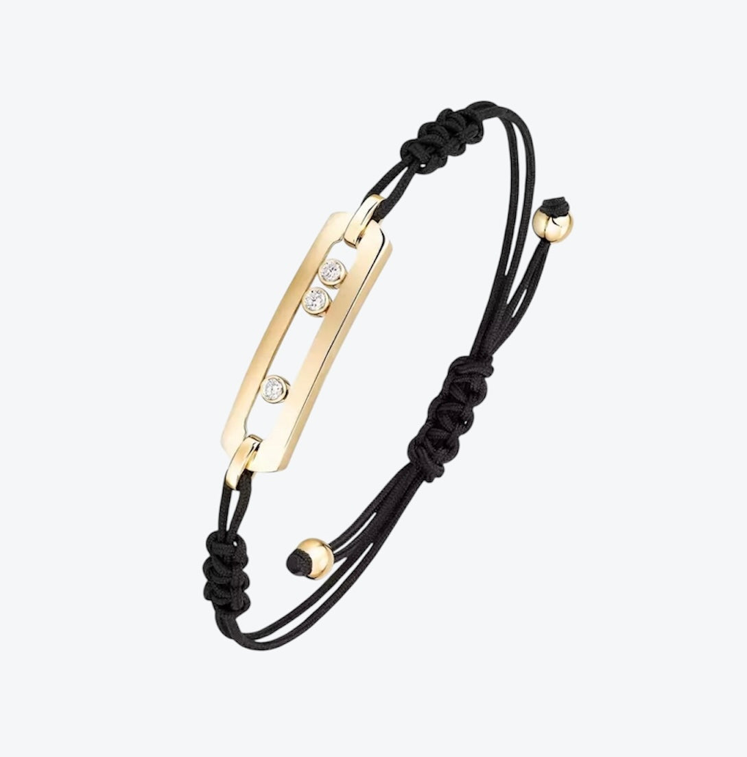 צמיד אהבה – חוט בגוון שחור עם אבזם בגוון זהב, 3 זירקונים נעים