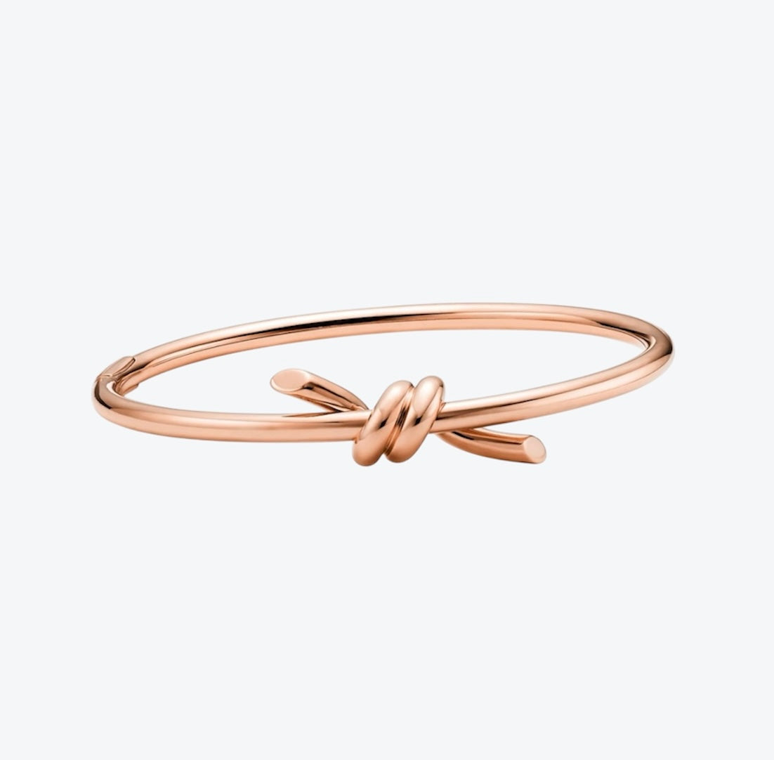 צמיד קשר עדין בגוון זהב ורוד למראה יוקרתי